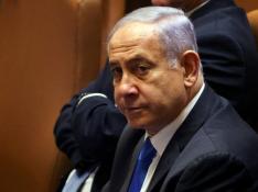Israeli Prime Minister Benjamin Netanyahu looks on during a special session of the Knesset, Israel's parliament, whereby a confidence vote will be held to approve and swear-in a new coalition government, in Jerusalem