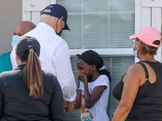 U.S. President Biden talks to residents as he tours a neighborhood hit by Hurricane Ida in LaPlace, Louisiana