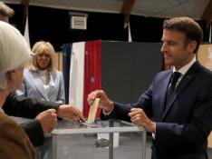 French President Macron casts his ballot during the final round of the country's parliamentary elections, in Le Touquet