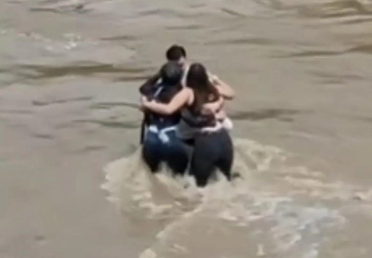 The embrace of three young Italians who died in a river